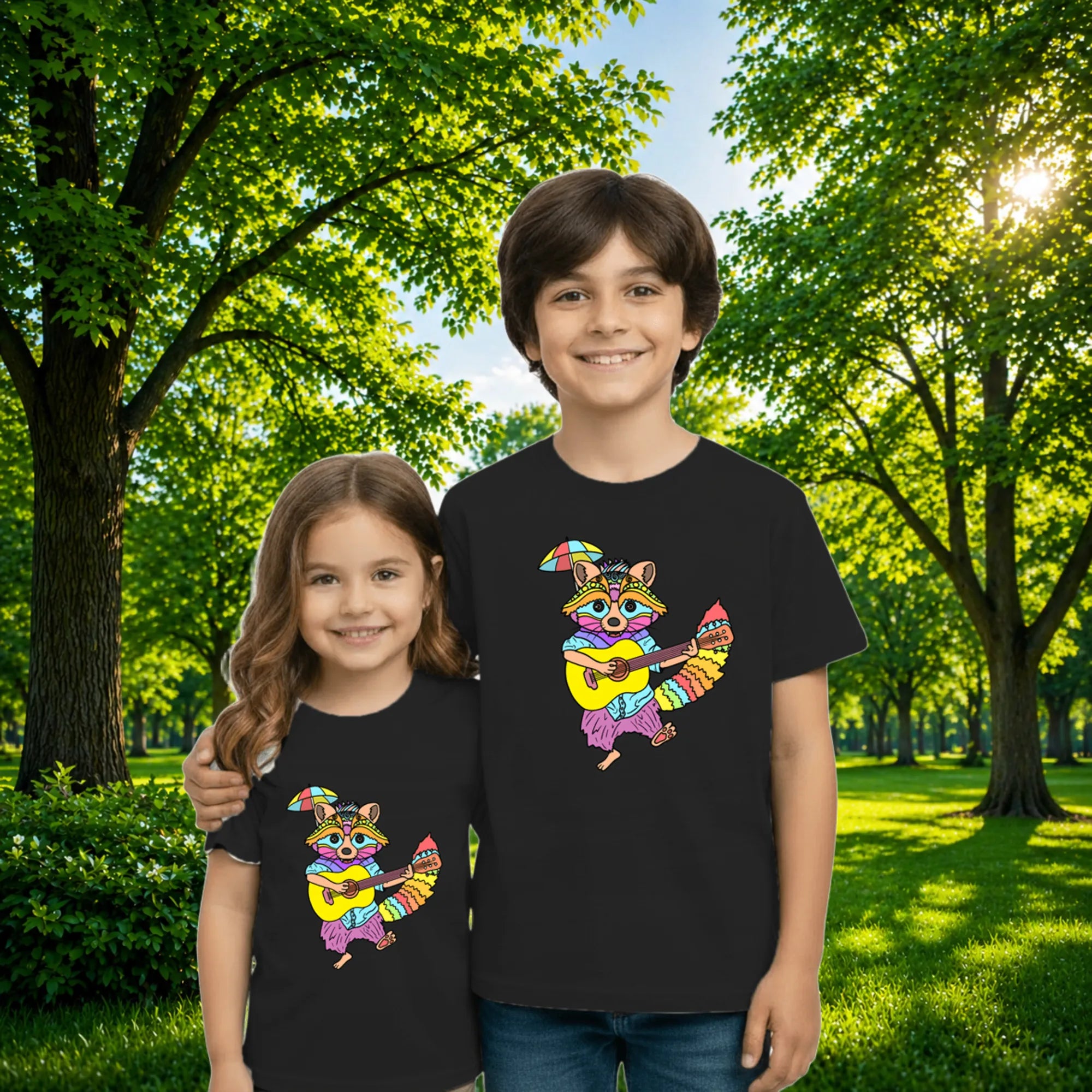 Sibling styling view of PaintzStories artistic kids t-shirt featuring Guitarist Racoon artwork with colourful illustration, premium cotton comfort, designer kids tshirt, and kids artistic t-shirt.