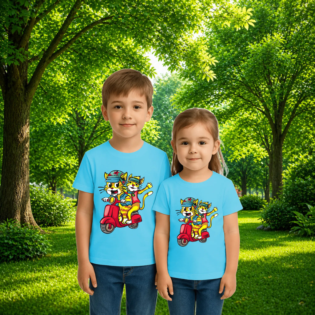 Sibling styling view of PaintzStories artistic kids t-shirt featuring Trendy Cats: Joyful Ride Along the Coastline - Light Blue artwork with colourful illustration, premium cotton comfort, gift for young artists, and artwork on tshirt.