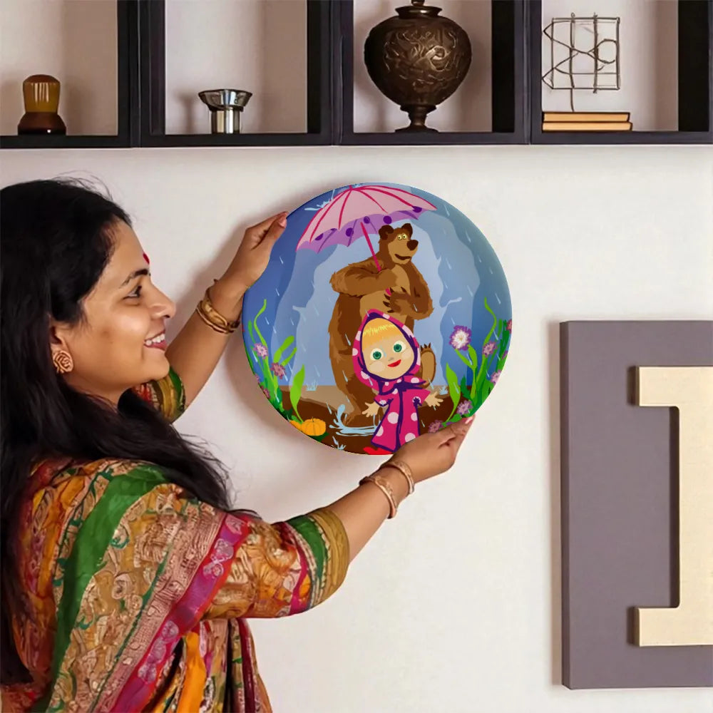 Woman holding A Bear and Girl’s Dance decorative plate