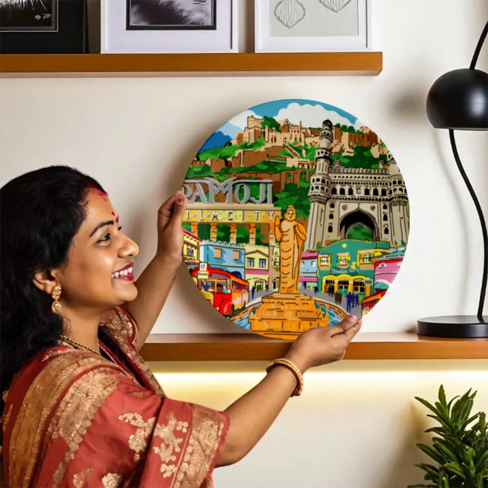 Woman showing Hyderabad’s Splendid Landscape plate