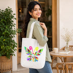 Model Holding PaintzStories "A Vibrant Butterfly" Artistic Tote Bag – Eco-Friendly Cotton Canvas